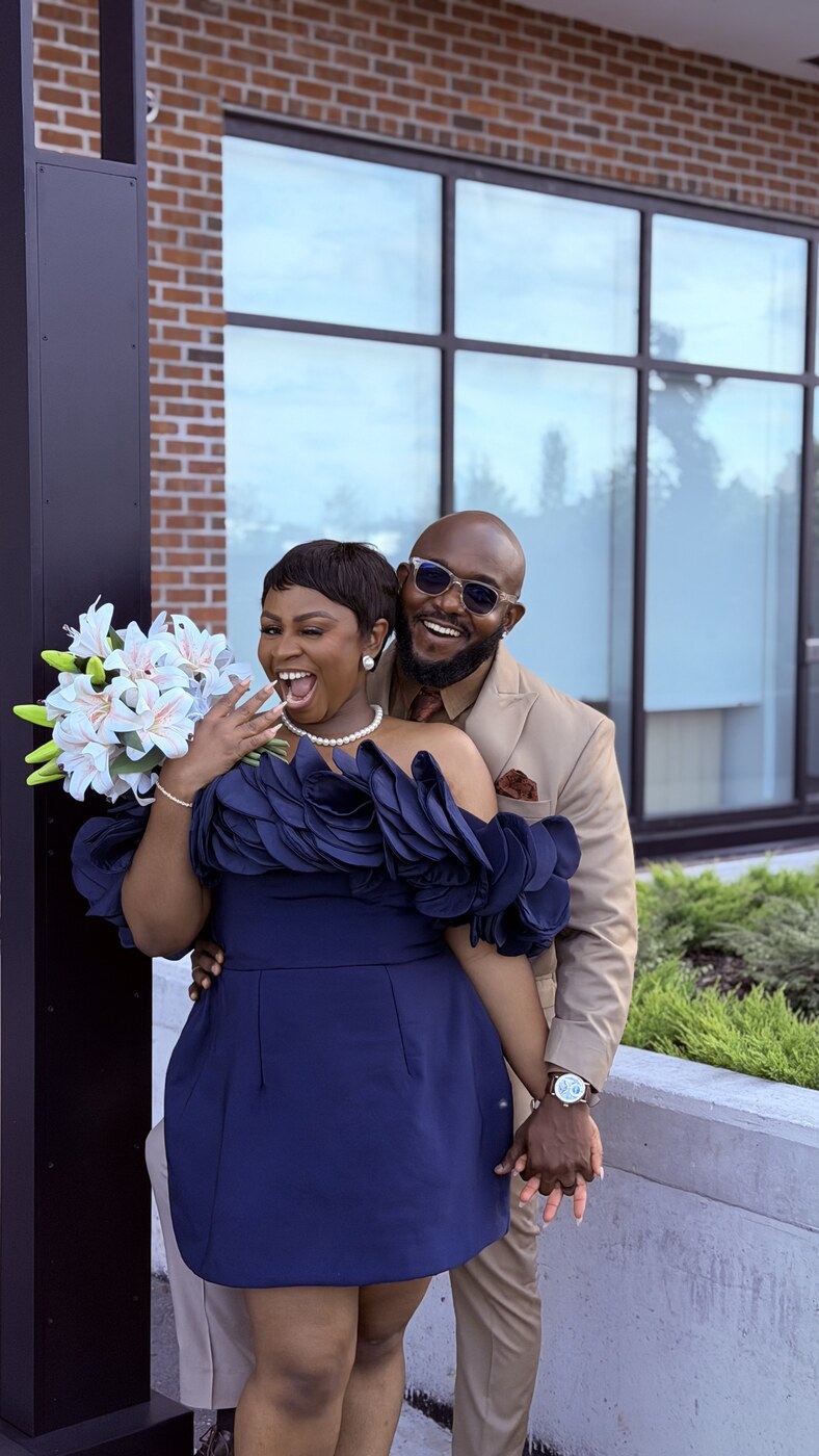 Anesi and Francis with a bouquet